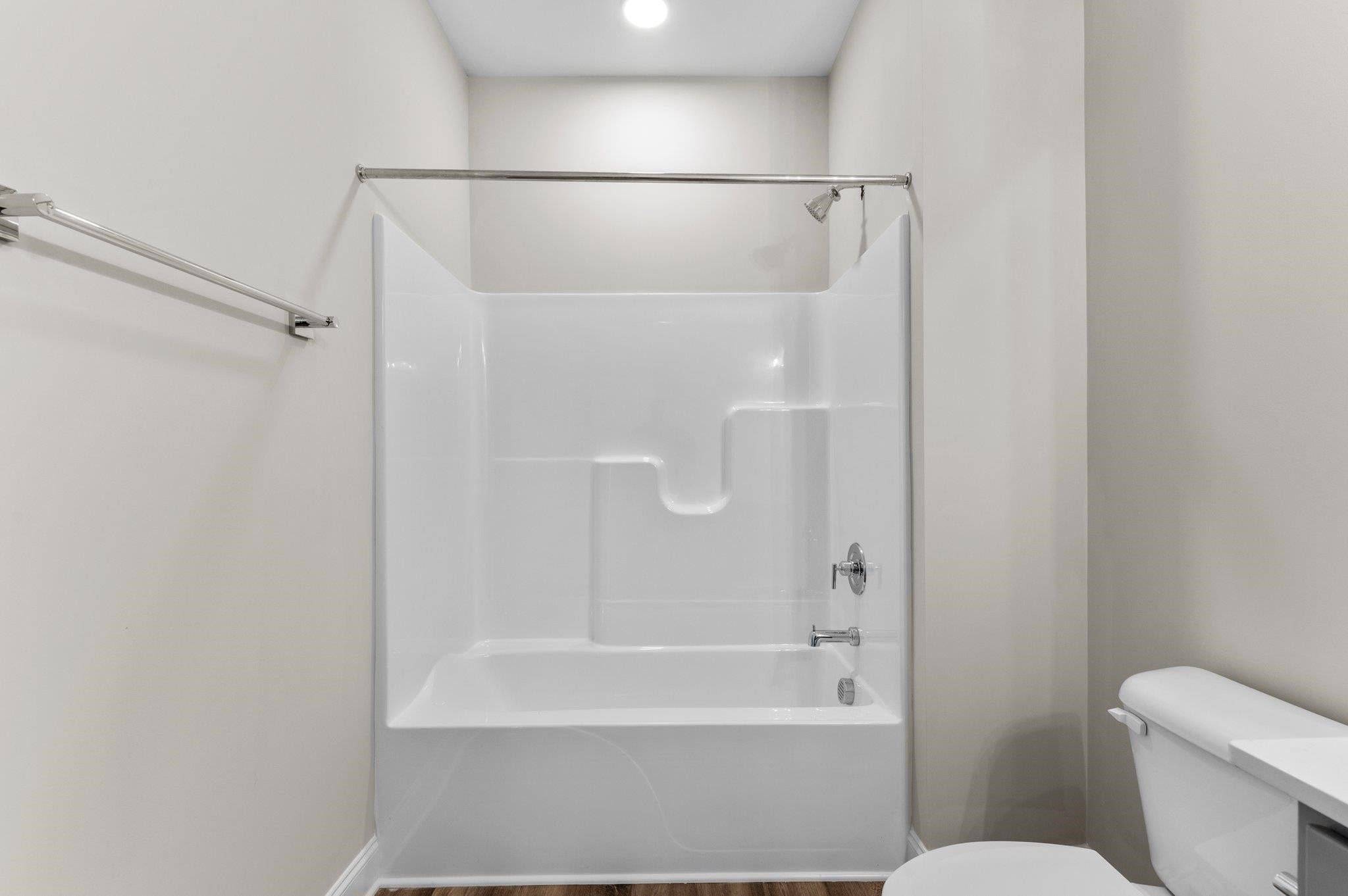 609 Marshskip Way, Unit 5 Rolesville, NC 27571 - Photo 18 of 39 a bathroom with a shower and a toilet