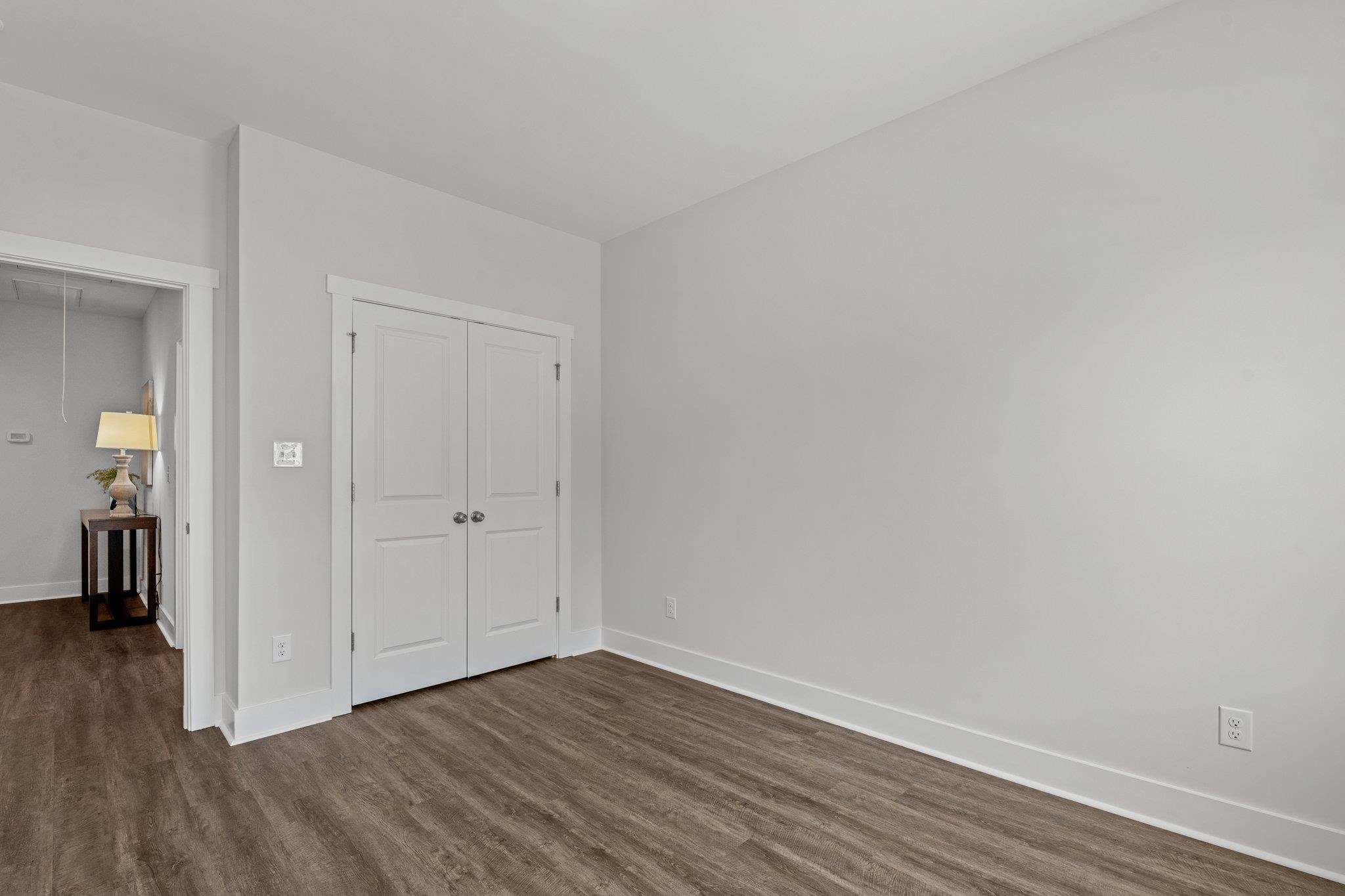 609 Marshskip Way, Unit 5 Rolesville, NC 27571 - Photo 20 of 39 a view of an empty room and wooden floor