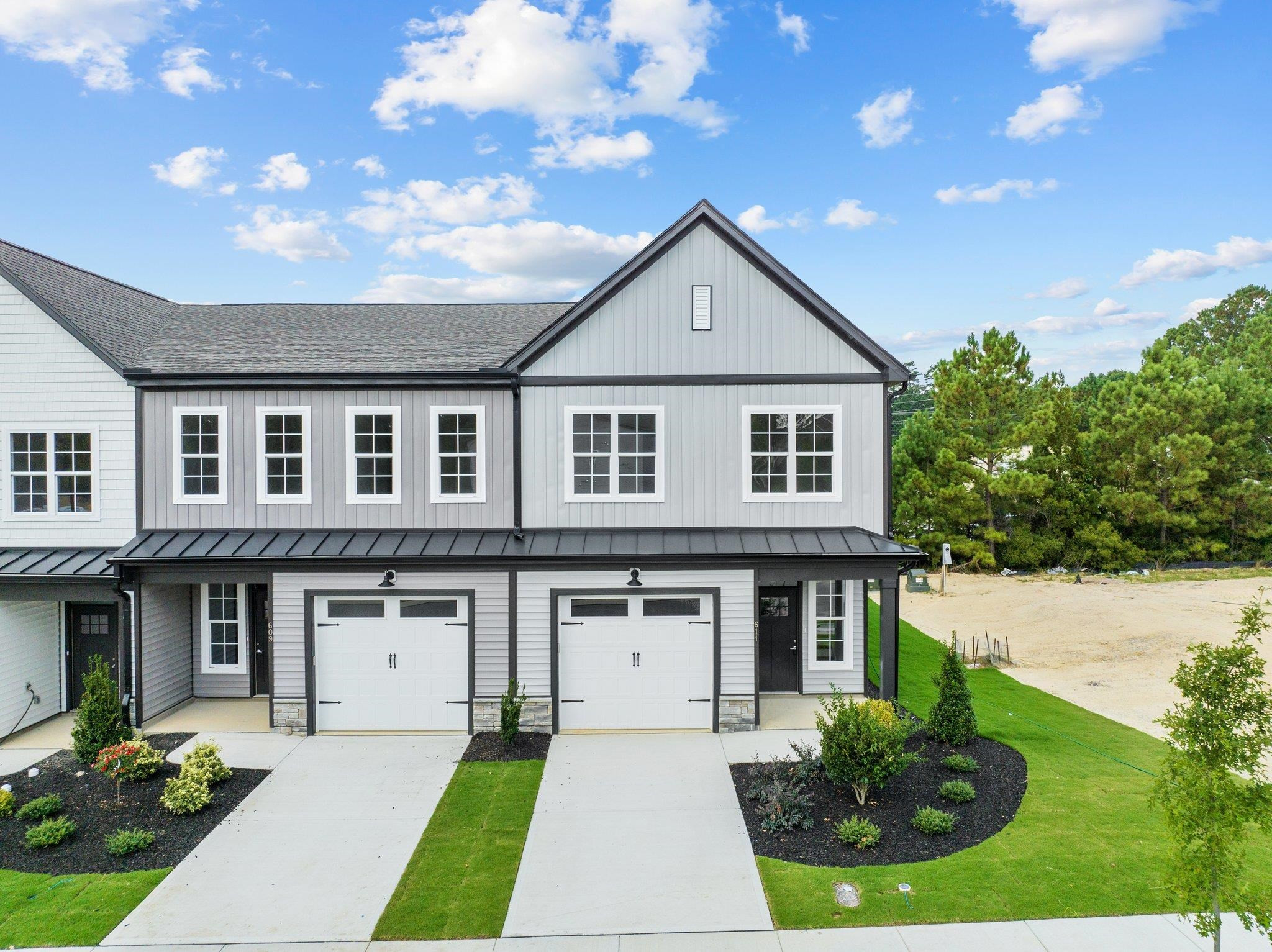 609 Marshskip Way, Unit 5 Rolesville, NC 27571 - Photo 25 of 39 a front view of a house with garden
