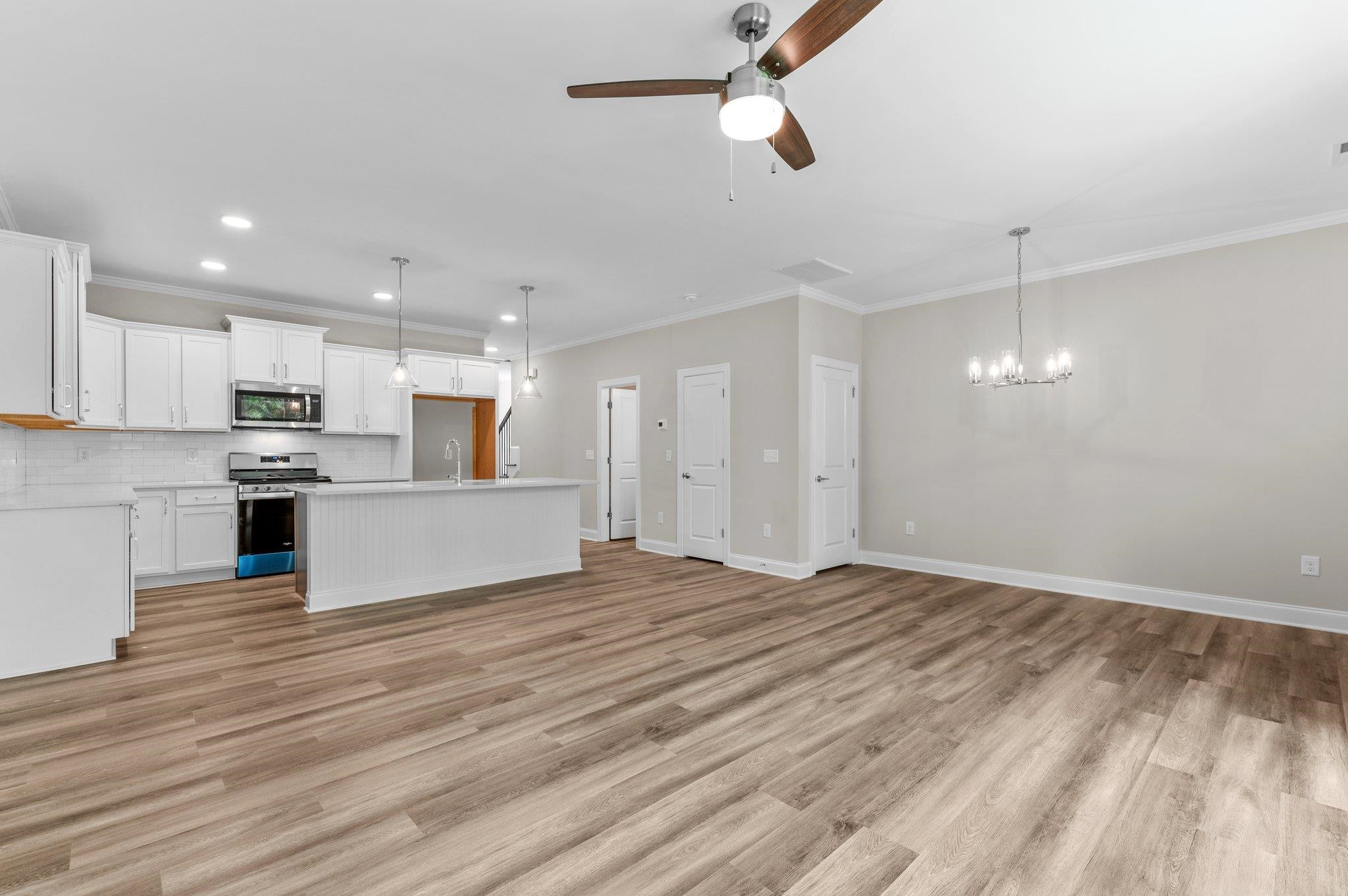 609 Marshskip Way, Unit 5 Rolesville, NC 27571 - Photo 6 of 39 a view of kitchen with wooden floor and window