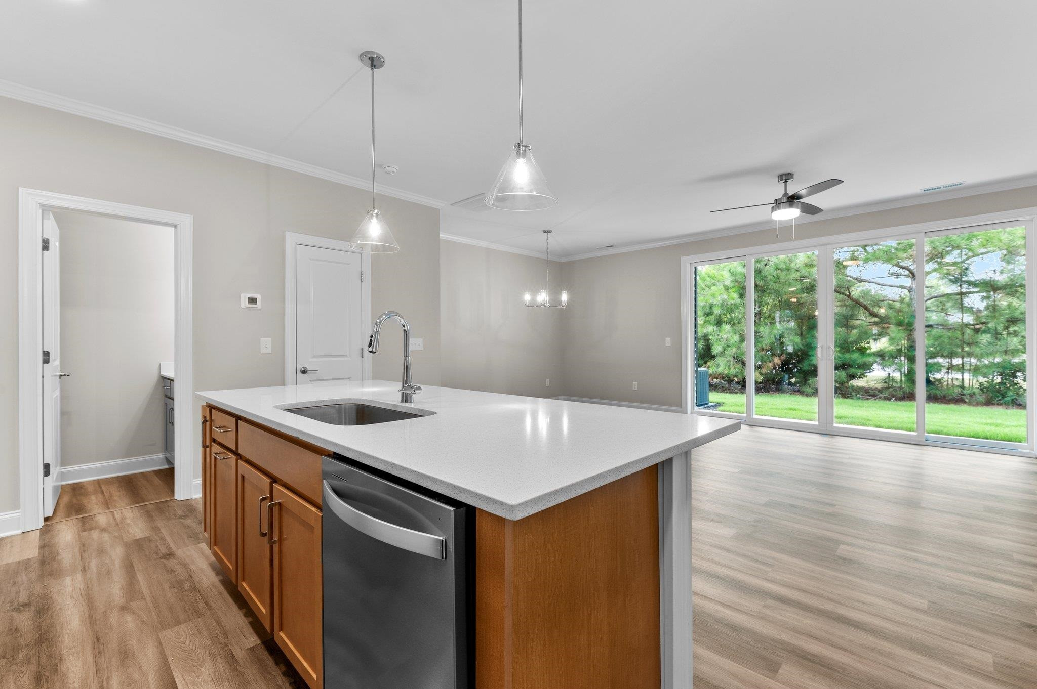 609 Marshskip Way, Unit 5 Rolesville, NC 27571 - Photo 8 of 39 a kitchen with a sink and wooden floor