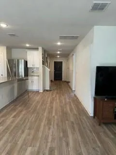 a view of a livingroom with a kitchen