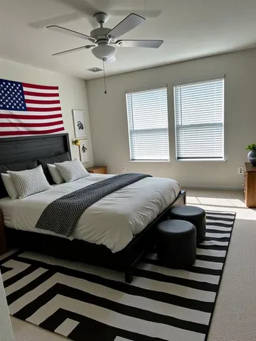 a bedroom with a bed and a chandelier