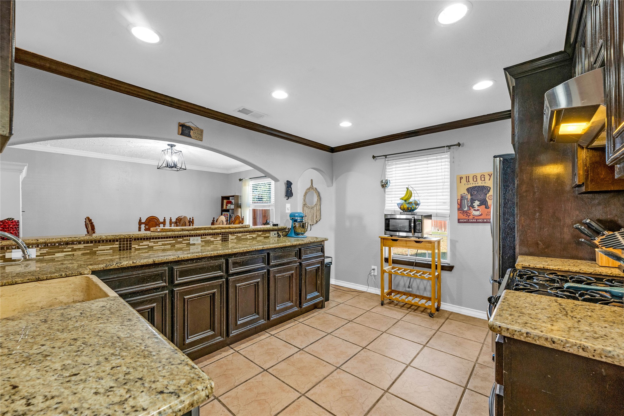 24014 Red Sky Drive Spring, TX 77373 - Photo 11 of 23 a large kitchen with stainless steel appliances granite countertop a sink and cabinets
