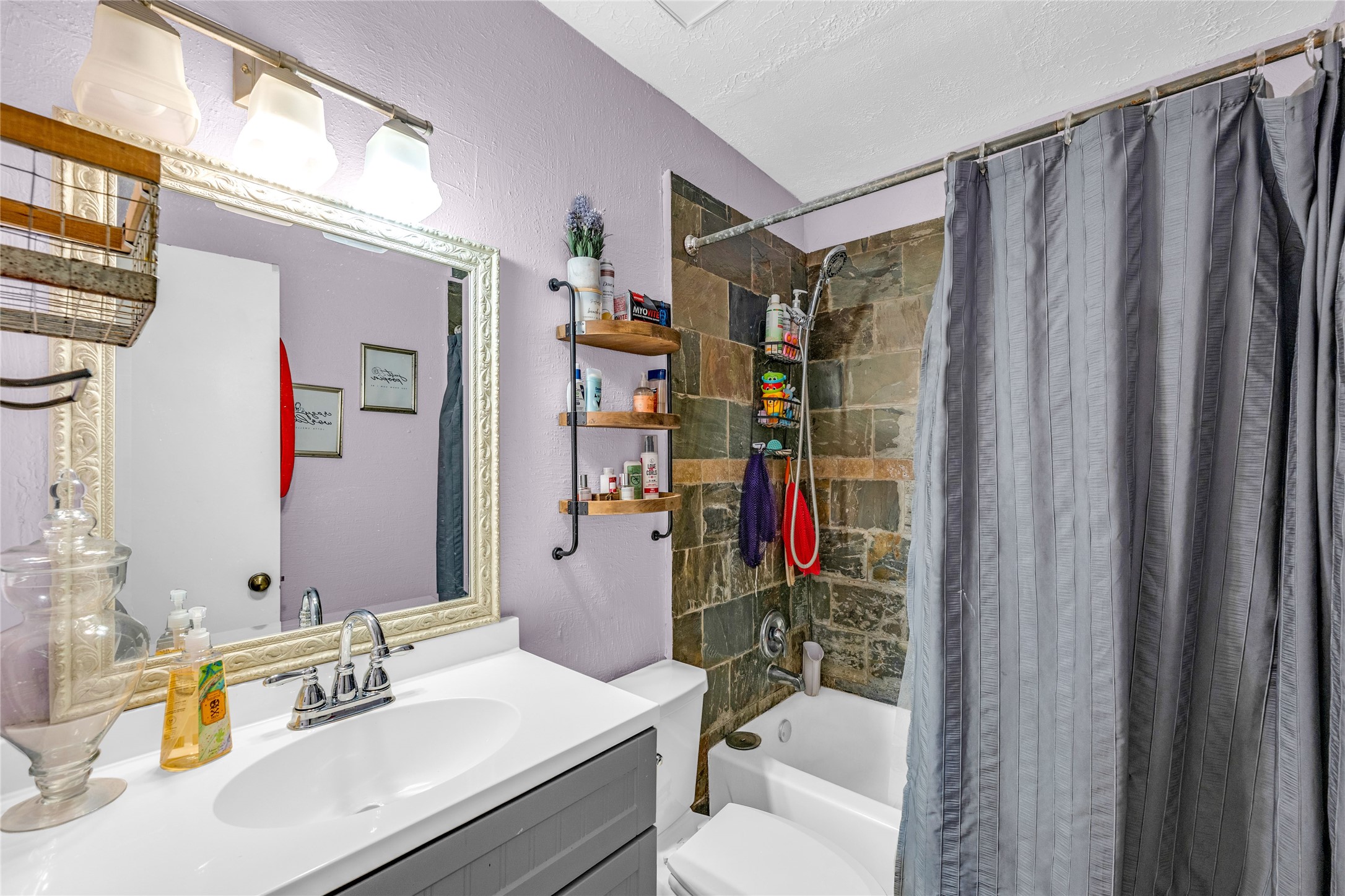 24014 Red Sky Drive Spring, TX 77373 - Photo 19 of 23 a bathroom with a sink vanity mirror and shower