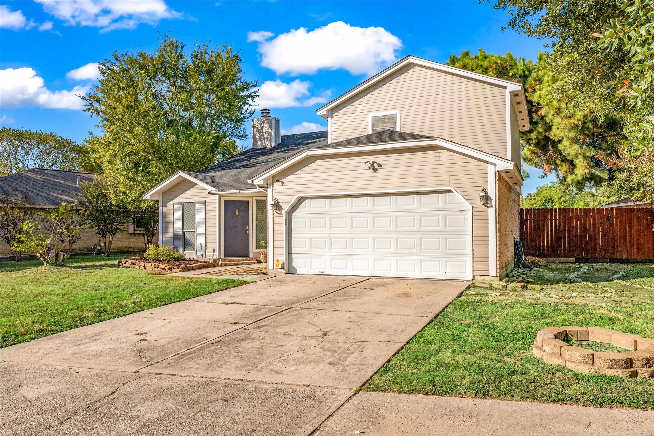 24014 Red Sky Drive Spring, TX 77373 - Photo 23 of 23 a view of a white house with a small yard and wooden fence