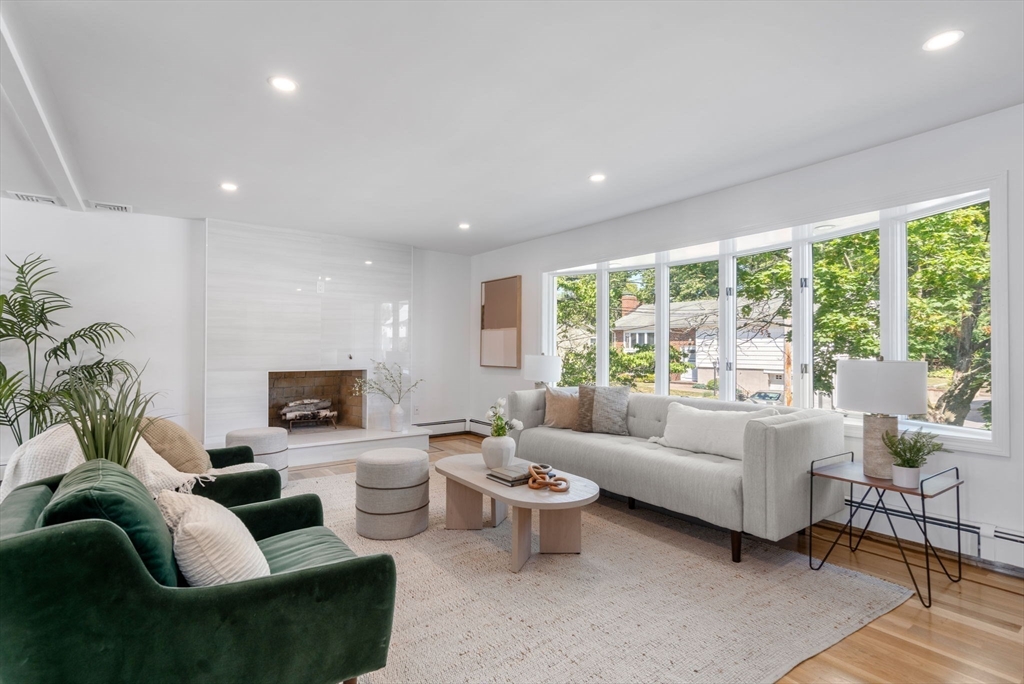 13 Doane Road Medford, MA 02155 - Photo 11 of 42 a living room with furniture and a large window