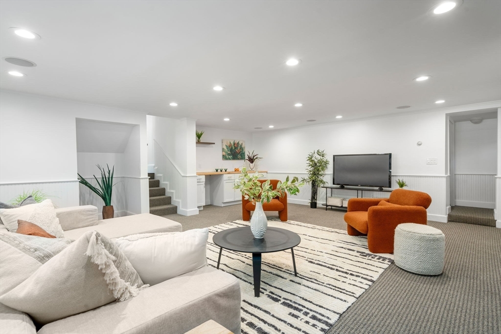 13 Doane Road Medford, MA 02155 - Photo 14 of 42 a living room with furniture and a flat screen tv