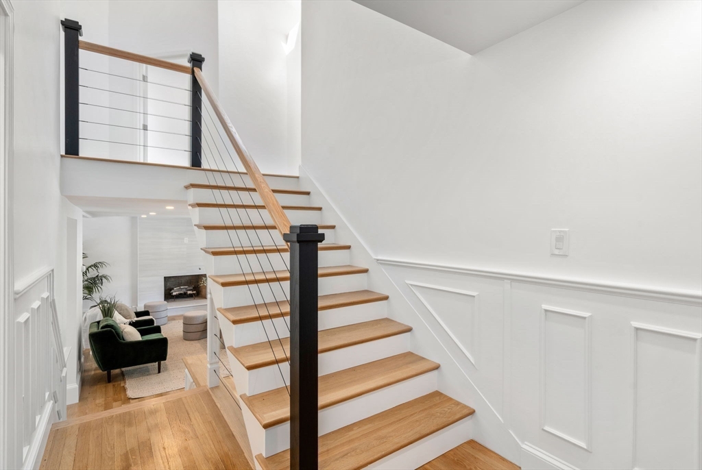 13 Doane Road Medford, MA 02155 - Photo 16 of 42 a view of entryway and hall with wooden floor