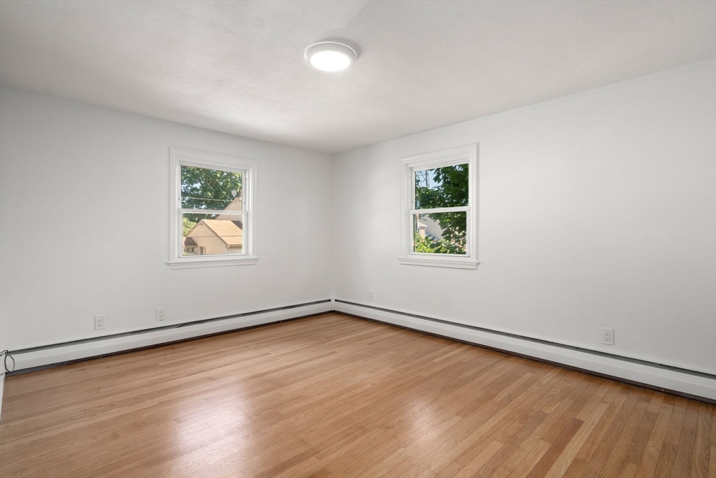 13 Doane Road Medford, MA 02155 - Photo 19 of 42 an empty room with a window