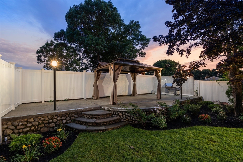 13 Doane Road Medford, MA 02155 - Photo 23 of 42 a view of a backyard with plants and tree