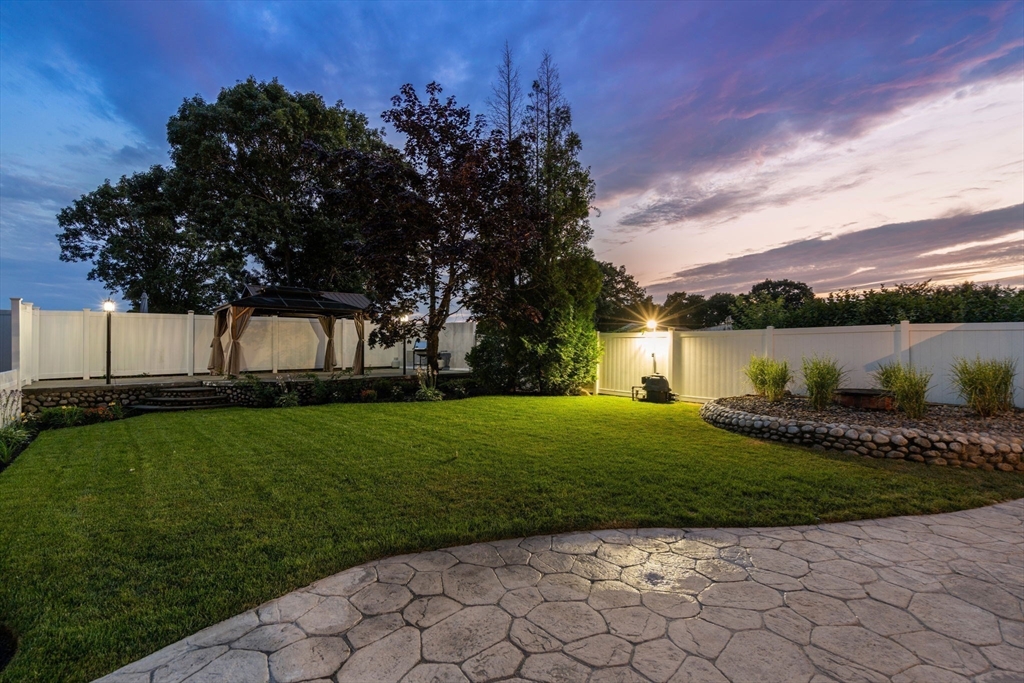 13 Doane Road Medford, MA 02155 - Photo 24 of 42 a view of a garden with a house in the background