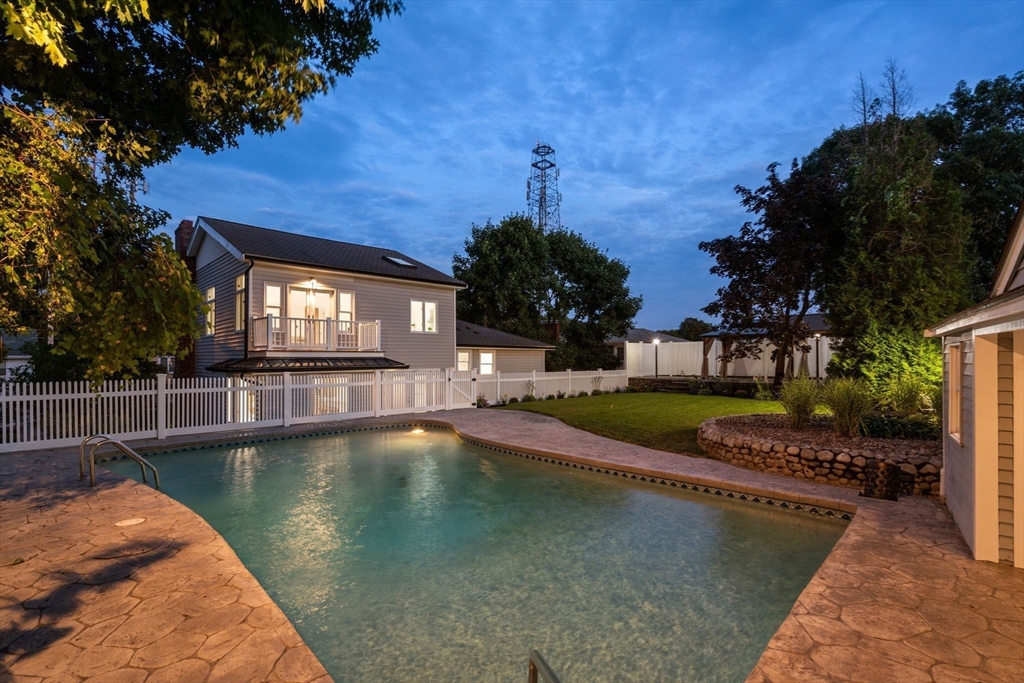 13 Doane Road Medford, MA 02155 - Photo 25 of 42 a view of a swimming pool from a lake view