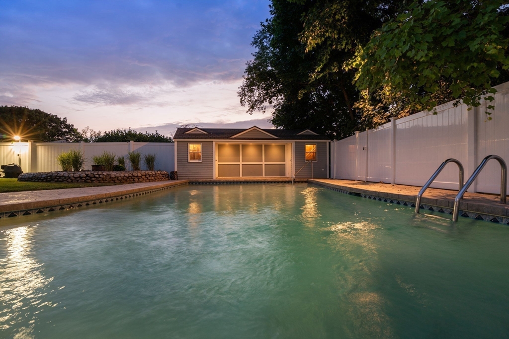 13 Doane Road Medford, MA 02155 - Photo 27 of 42 a view of a swimming pool with a lake