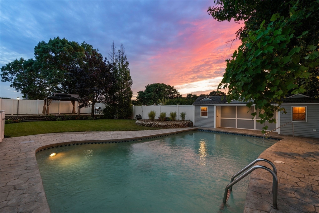 13 Doane Road Medford, MA 02155 - Photo 28 of 42 a view of a house with swimming pool next to a yard