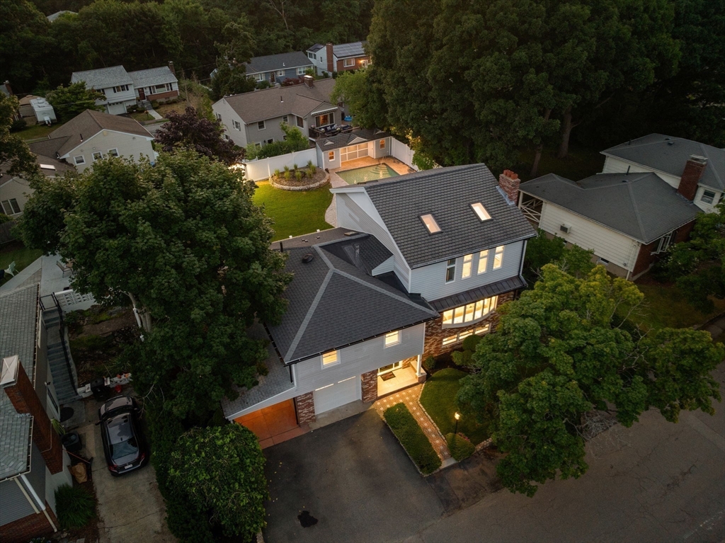 13 Doane Road Medford, MA 02155 - Photo 30 of 42 an aerial view of a house with a yard and parking spaces