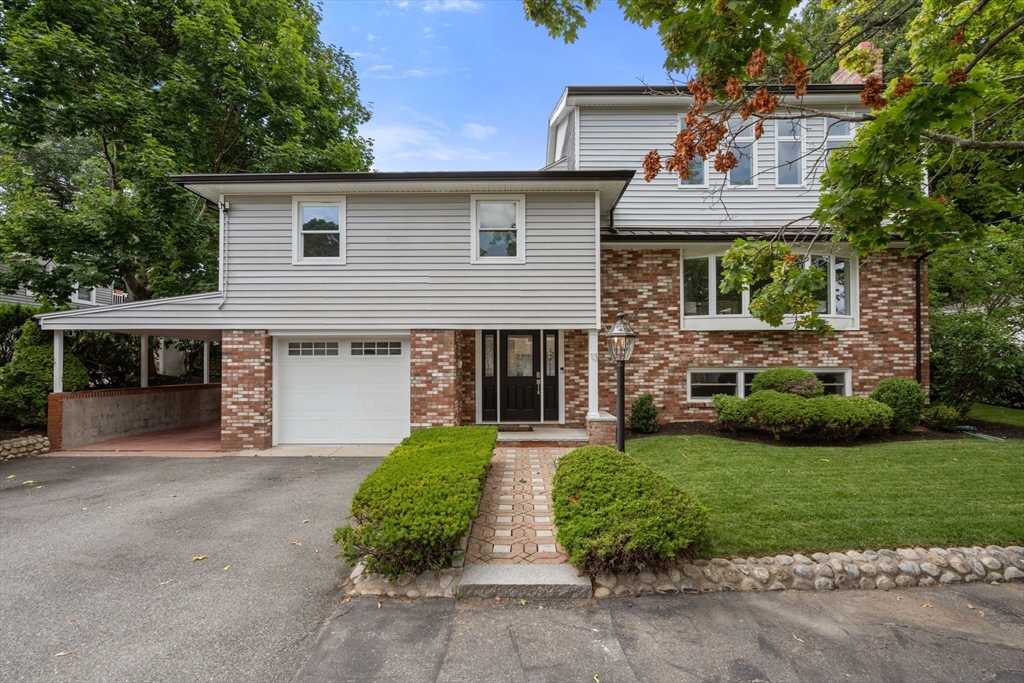 13 Doane Road Medford, MA 02155 - Photo 40 of 42 a front view of house with yard and green space