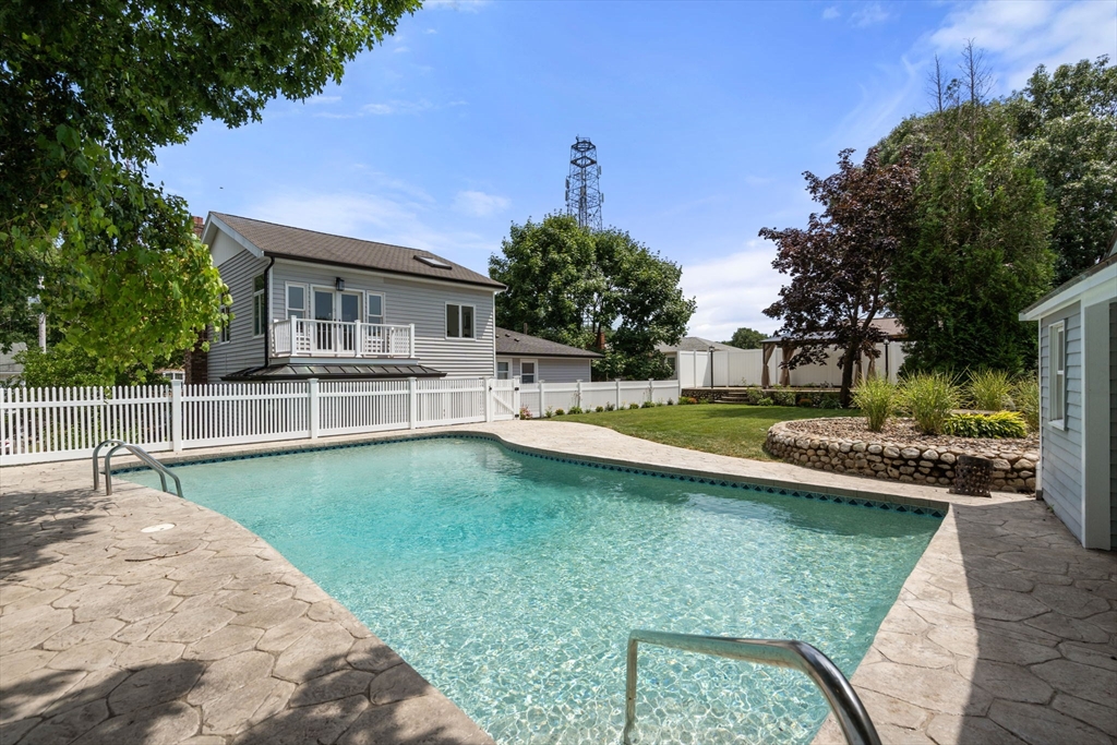 13 Doane Road Medford, MA 02155 - Photo 41 of 42 a view of a house with a yard patio and fire pit