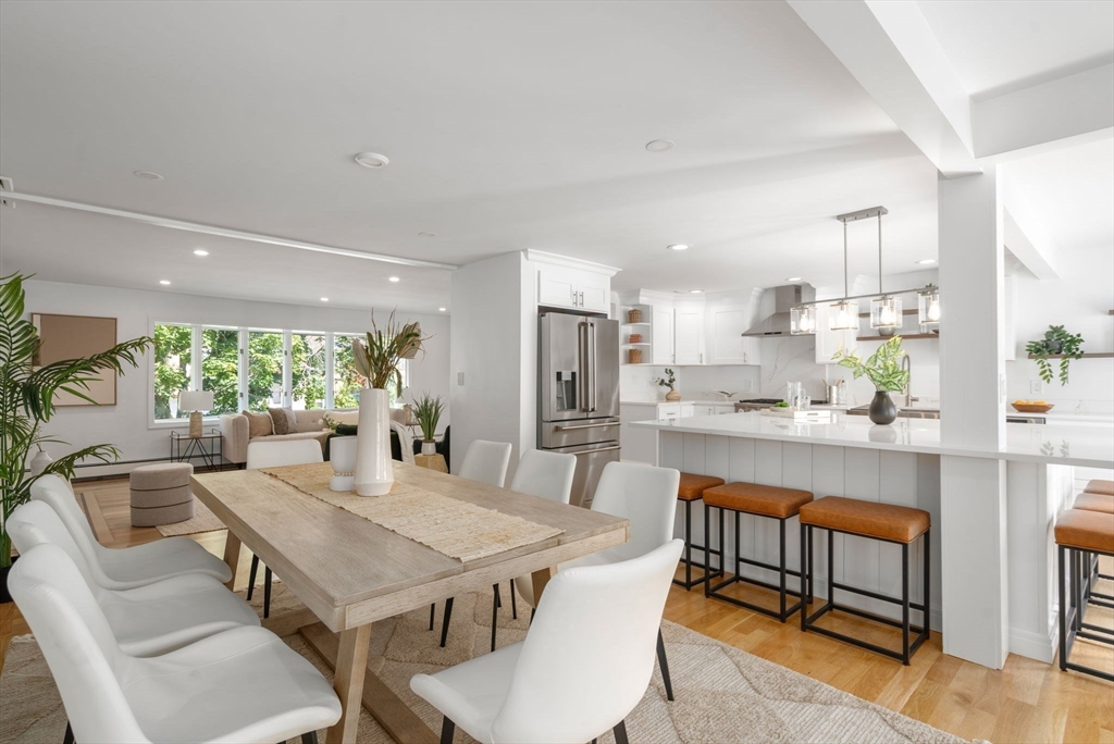 13 Doane Road Medford, MA 02155 - Photo 6 of 42 a view of a dining room with furniture window and wooden floor