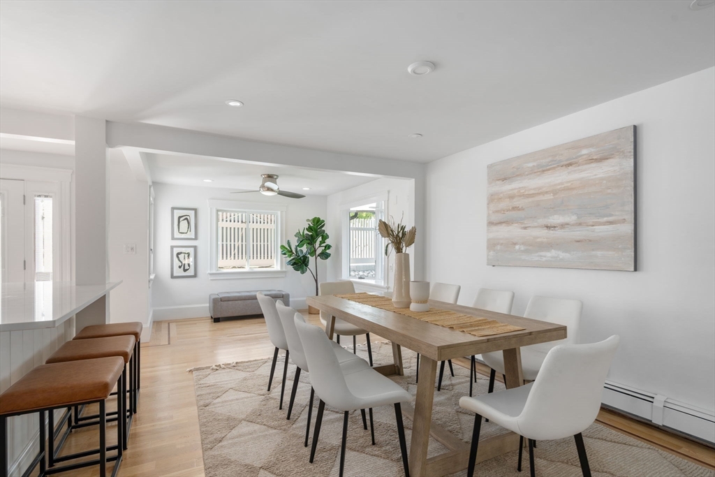 13 Doane Road Medford, MA 02155 - Photo 7 of 42 a view of a dining room with furniture and wooden floor