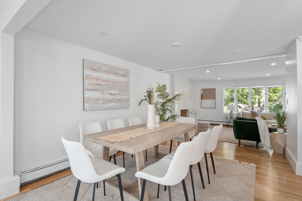 13 Doane Road Medford, MA 02155 - Photo 8 of 42 a view of a dining room with furniture window and wooden floor