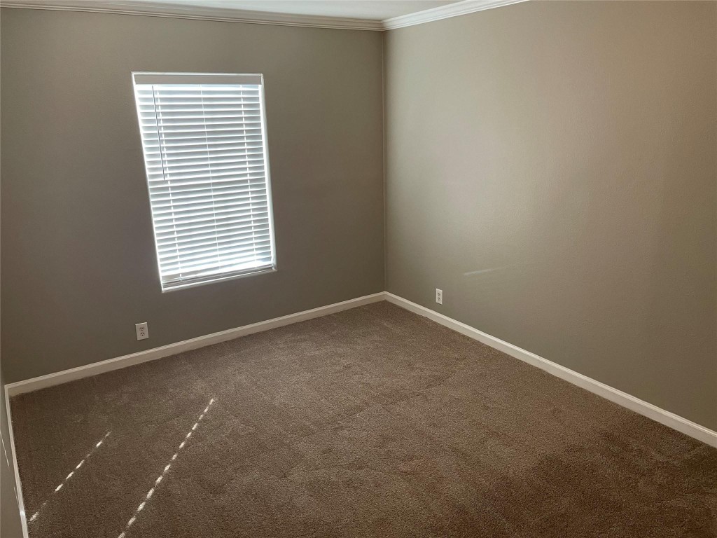8715 Knox Street, Unit A Houston, TX 77088 - Photo 5 of 11 an empty room with a window