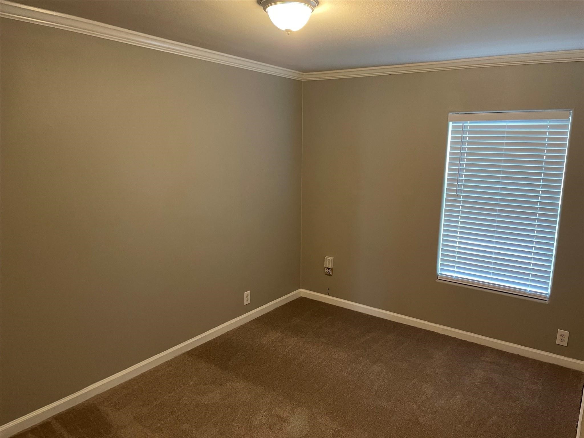 8715 Knox Street, Unit A Houston, TX 77088 - Photo 7 of 11 an empty room with a window