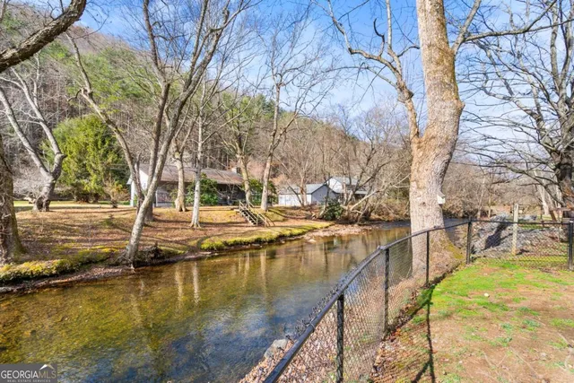 a view of a lake with trees