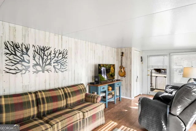 a view of a livingroom with furniture and window