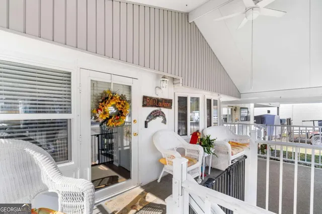 a bed room with a bed table and chairs