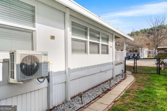 a view of two chairs in a patio
