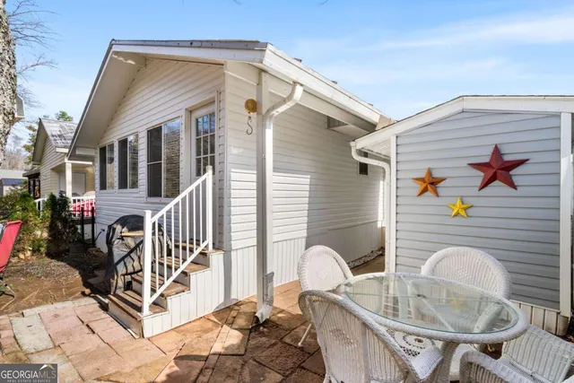 a view of a chairs and tables in patio
