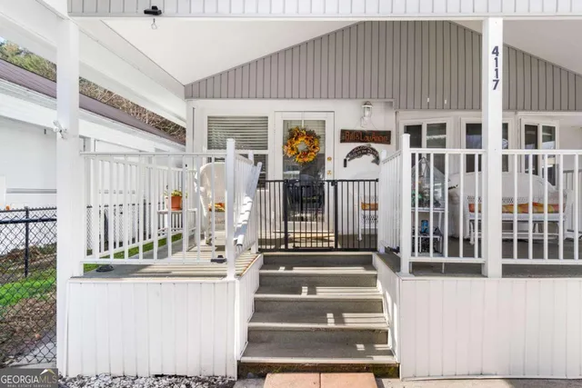 a kitchen with stainless steel appliances granite countertop a refrigerator a stove and a wooden floors