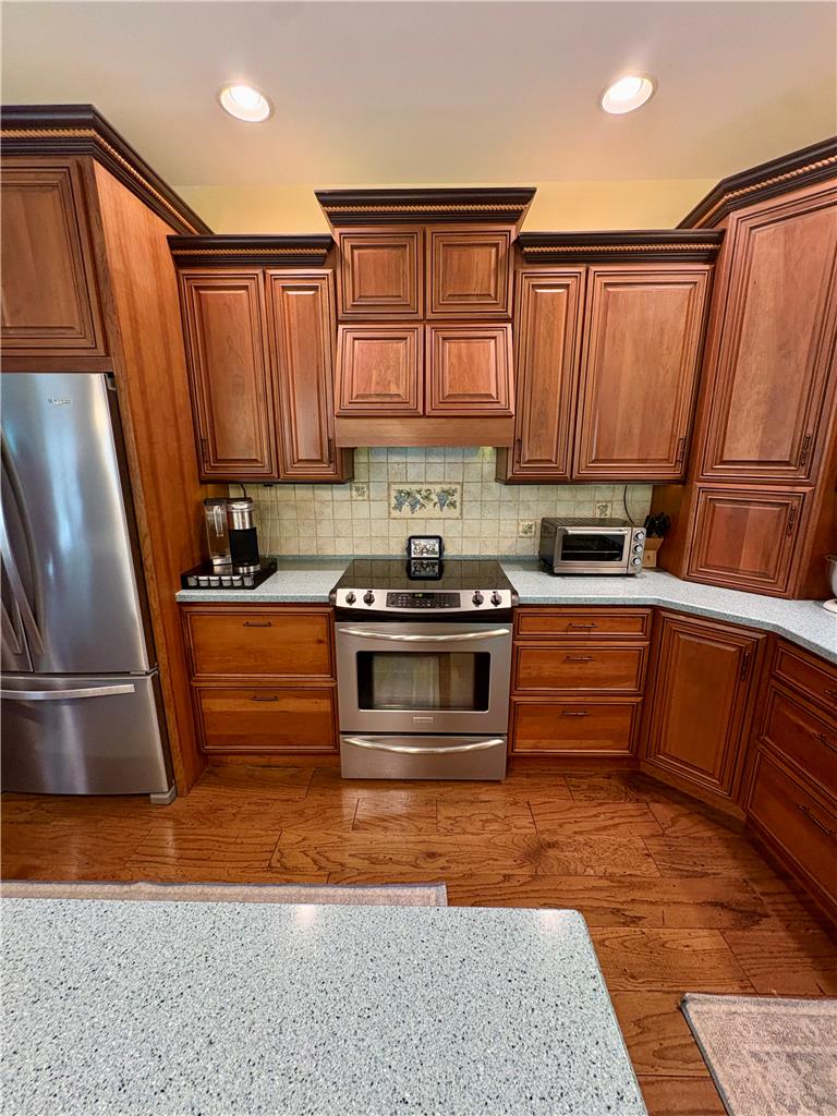 1222 Spring Road Andreas, PA 18211 - Photo 7 of 38 A well-equipped kitchen featuring hardwood floors and stainless steel appliances awaits culinary adventures.