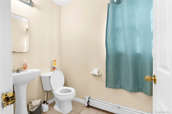 a white toilet sitting next to a bathroom sink