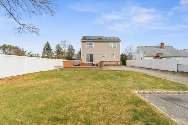 a view of a swimming pool with an outdoor seating