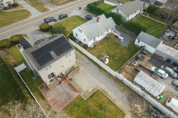 an aerial view of a house with outdoor space