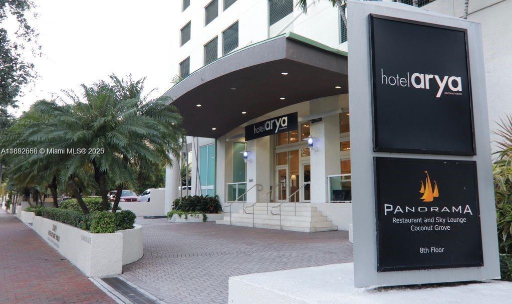 2889 McFarlane Road, Unit 909 Miami, FL 33133 - Photo 2 of 36 a view of a building with a tree