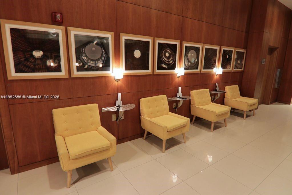 2889 McFarlane Road, Unit 909 Miami, FL 33133 - Photo 24 of 36 a couple of chairs sitting in front of a door