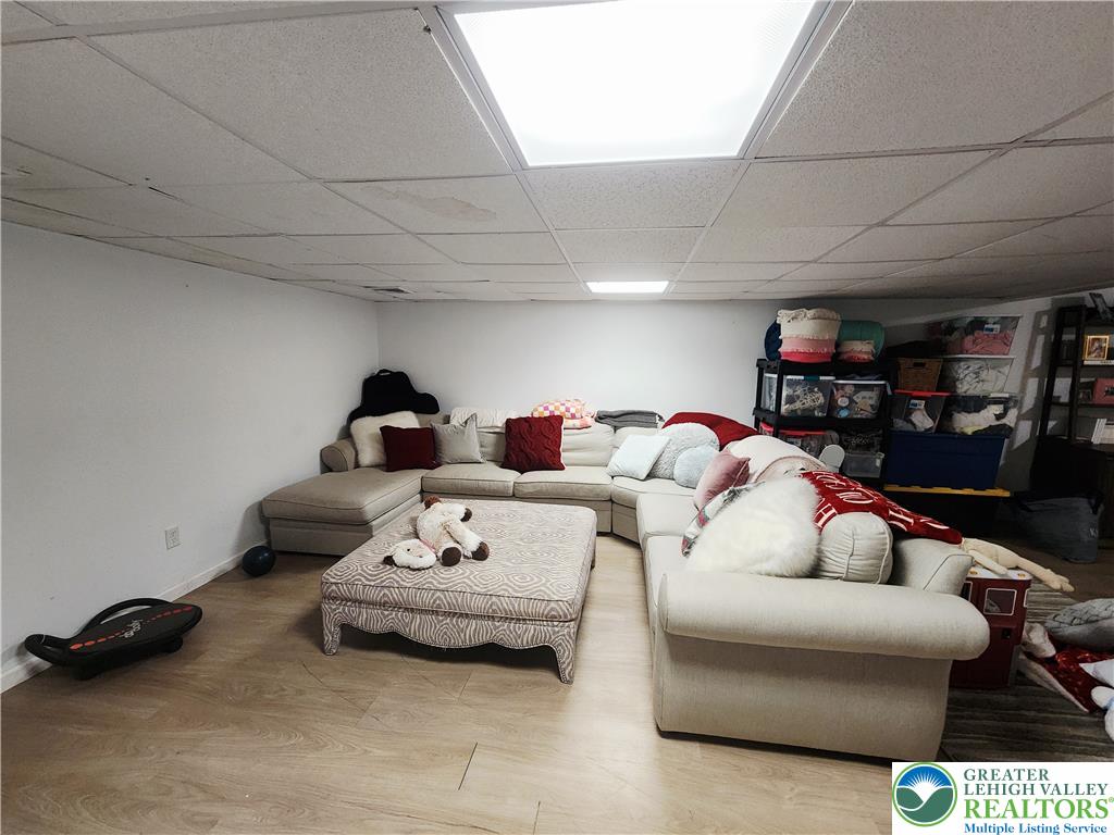 237 Ridings Circle Macungie, PA 18062 - Photo 67 of 70 Smooth wood-style flooring runs throughout this versatile finished basement space.