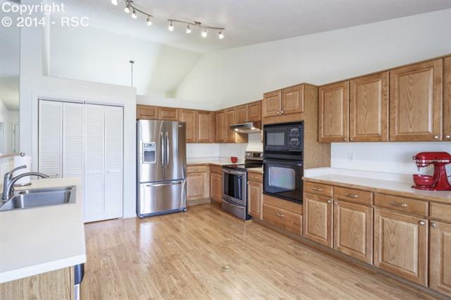 8530 Tibbs Road Peyton, CO 80831 - Photo 6 of 15 Spacious Kitchen w/All Appliances, Breakfast Bar, Pantry & Plenty of Prep/Storage Space