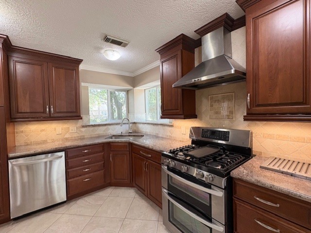 17706 Woodlode Lane Spring, TX 77379 - Photo 13 of 31 a kitchen with a stove and a sink