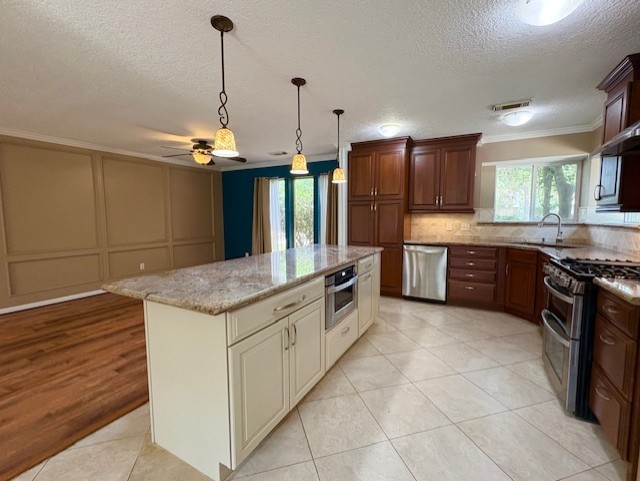 17706 Woodlode Lane Spring, TX 77379 - Photo 14 of 31 a kitchen with stainless steel appliances granite countertop a sink a stove and a wooden floor