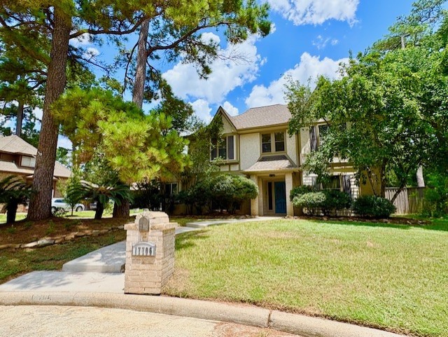 17706 Woodlode Lane Spring, TX 77379 - Photo 2 of 31 a front view of a house with yard and green space