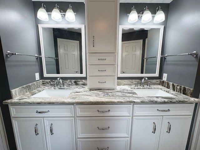 17706 Woodlode Lane Spring, TX 77379 - Photo 21 of 31 a bathroom with a sink and a mirror