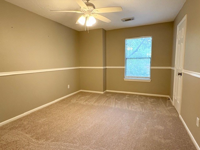 17706 Woodlode Lane Spring, TX 77379 - Photo 22 of 31 an empty room with windows and fan