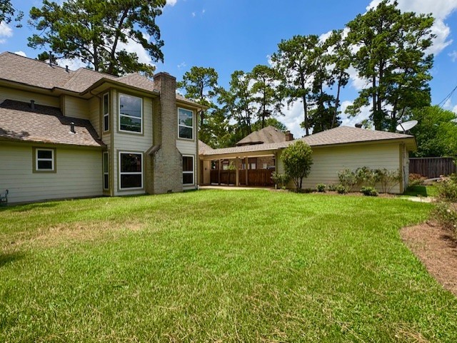 17706 Woodlode Lane Spring, TX 77379 - Photo 26 of 31 a front view of a house with a garden