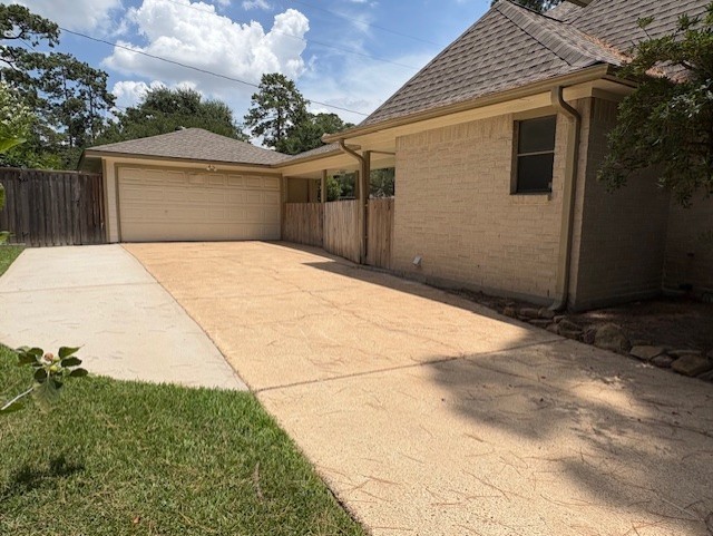 17706 Woodlode Lane Spring, TX 77379 - Photo 28 of 31 a front view of a house with a yard and garage
