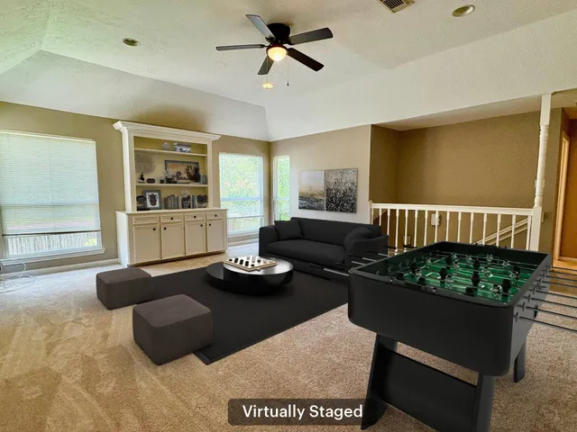 a open kitchen with stainless steel appliances granite countertop a stove a refrigerator and a sink with granite countertops