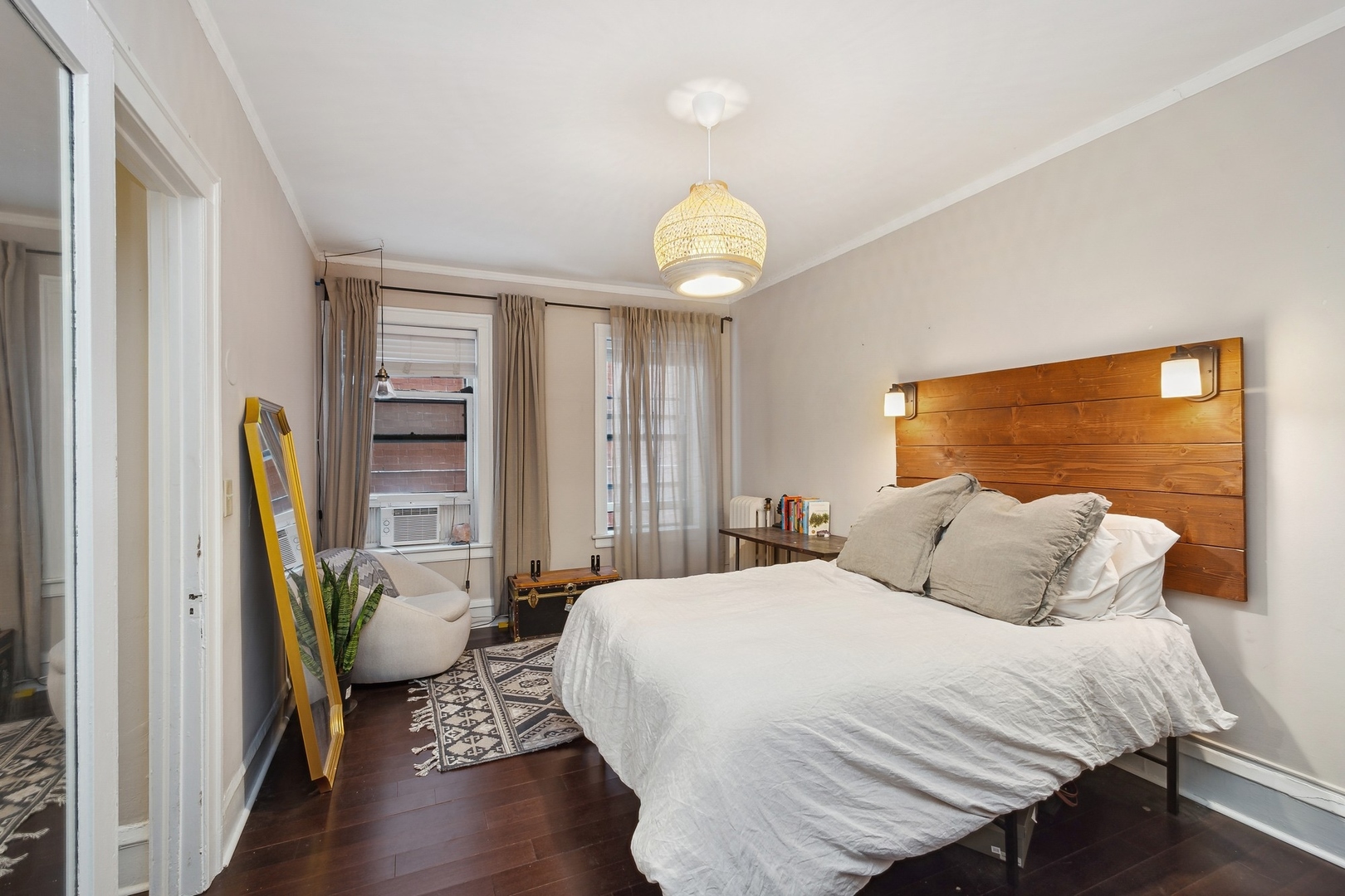 400 West Deming Place, Unit 2K Chicago, IL 60614 - Photo 8 of 10 a bedroom with a bed and a chandelier
